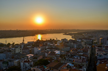 View of Istanbul and Golden Horn from the observation deck of the Galata tower. Panoramic view from above at sunset
