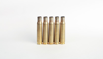 rifle bullet shell casings on white background
