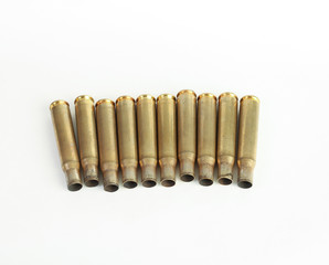 rifle bullet shell casings on white background