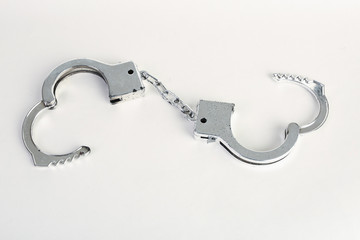 Hand cuffs on a white background