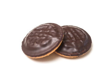 Closeup of two chocolate cakes with jam on white background