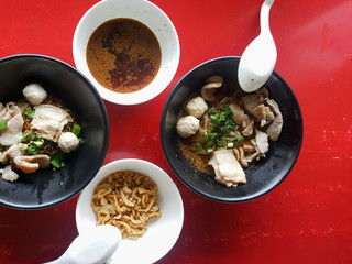 Traditional Thai Style Noodle Dish, Boat Noodles With Meat Ball, Slice Pork And Herb Drink For Refreshment, Black Soup From Cow or Pigs blood Mixed, Flavor Hot And Spicy