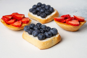 Toast with fresh blueberry and strawberry with copy space