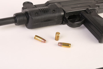 gun and bullets on a white background