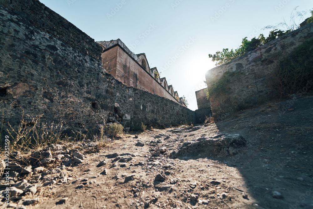 Wall mural the abandoned greek village of kayakoy, fethiye, turkey. ghost town kayakoy. turkey, evening sun. an