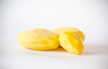 Peeled potatoes on the background closeup