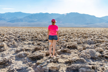 girl standing in death valley - devil's golf course