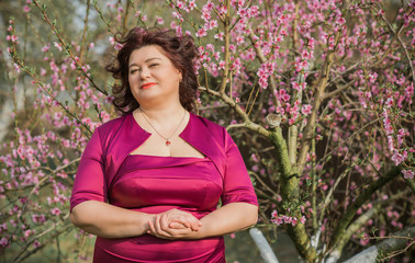 Middle age plus size woman enjoying the life. A mature lady with excess weight, stylishly dressed. Natural beauty