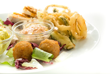 Italian seafood appetizer wit squids and white backdrop
