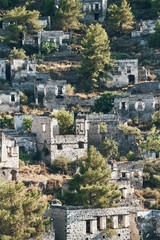 The abandoned Greek village of Kayakoy, Fethiye, Turkey. Ghost Town Kayakoy. Turkey, evening sun. Ancient abandoned buildings of rock and stone.