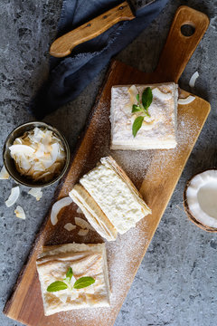 Delicious puff pastry cream cake dessert filled with vanilla and coconut custard