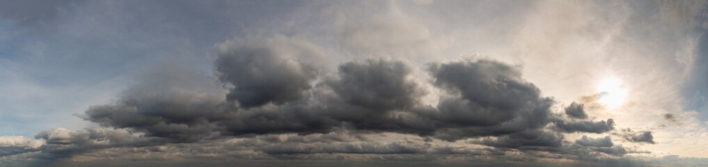 Fantastic dark thunderclouds at sunrise