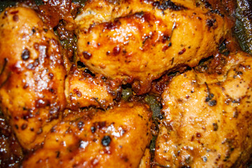 Chicken breast baked in the oven with spices. Close up.