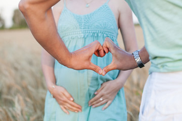 A pregnant woman and a man love their unborn child