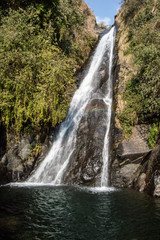 Fototapeta premium Bhagsu Nag Waterfall in McLeod Ganj, India