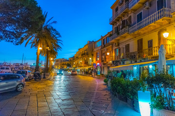 Fototapeta na wymiar La Maddalena promenade by the sea at night
