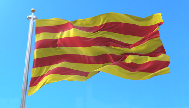 Catalonia flag waving at wind in blue sky