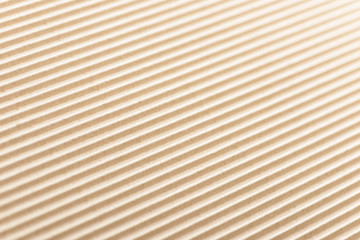 Carton or cardboard packing material. Texture of corrugated paper sheets made from cellulose. Supplies for creating boxes and packaging. Pasteboard background. Natural brown cardboard surface.