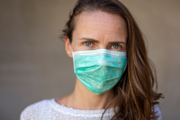 Woman wearing mask as part of coronavirus prevention campaign
