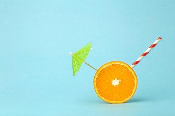 Food summer minimal concept. Orange juice and juicy tropical fruits on a light colored background