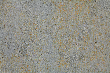 Metallic wall background, texture. An old grey and rusty surface with faded uneven color. Abstract mosaic rust pattern on a cracked painted surface. The wall and fence sketches and colors
