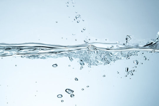 Water splash isolated. Close up of splash of water forming flower shape, isolated on white background.