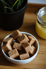 Close up photo of brown sugar bricks in a bowl, stylish food photo