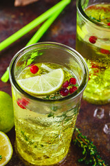 Lime Lemonade with thyme, cranberry and ice.