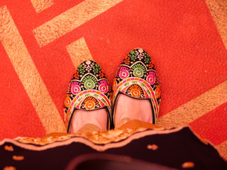 Punjabi woman shoes isolated on a red carpet