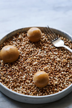 Overhead view of a sweet dessert on a white marble table
