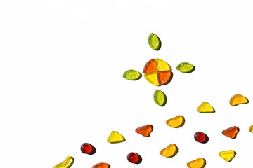 Colorful jelly candies in fruits shapes. Top view of positive and sweet composition on white background.