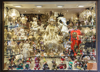 Old town of Venice. A showcase of a souvenir shop with masks on a narrow street away from Piazza San Marco in Venice, Italy