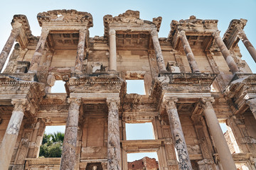 The ruins of Celsus Library in Ephesus at sunny evening sun. Beautiful light of the old ancient rocks and stones, turkey