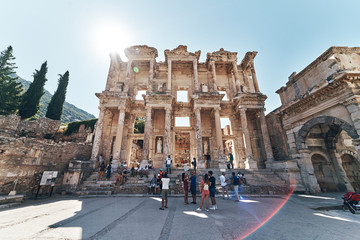The ruins of Celsus Library in Ephesus at sunny evening sun. Beautiful light of the old ancient...