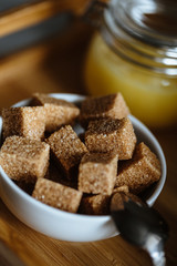 Close up photo of brown sugar bricks in a bowl, stylish food photo