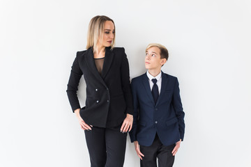 Parenting, family and single parent concept - A happy mother and teen son smiling on white background.