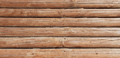 Fototapeta premium Wooden background in the form of logs. Free space.