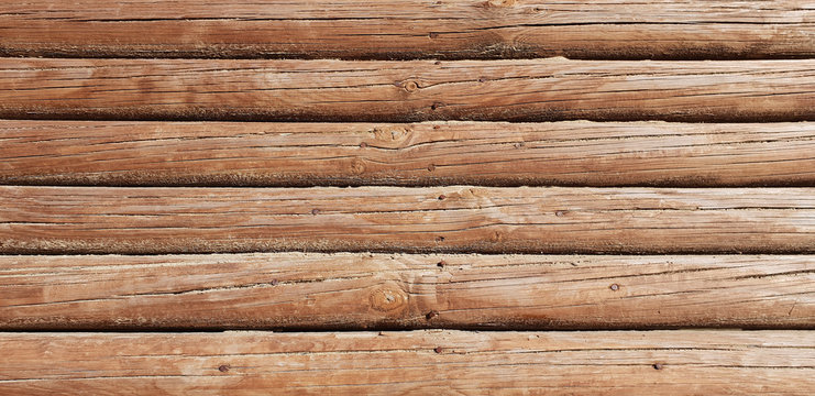 Wooden background in the form of logs. Free space.