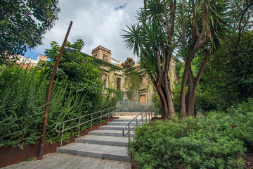 Façade of an abandoned building in a public park in Barcelona