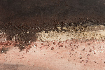 Colorful background composed of sand texture on canvas simulating an abstract landscape