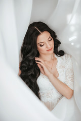 Stock Photo - Beautiful woman in white lace lingerie. Bride morning