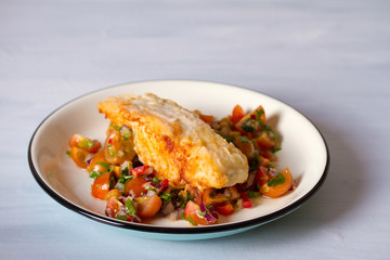 Pan fried cod fish with tomato salsa