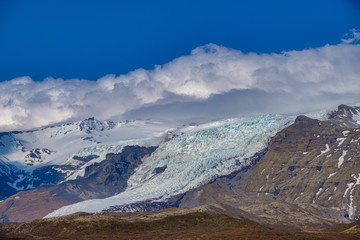 Beautiful blue iced glaciers retreating back into the mountains on the south east of Iceland