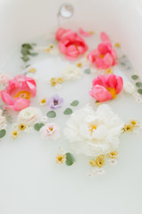 Naklejka na ściany i meble Fresh flowers in the bathroom. Health and beauty.