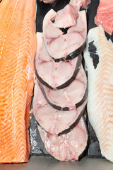salmon and slice of swordfish at a fishmonger