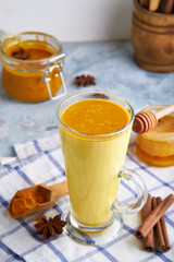 Turmeric milk. Cooked golden milk in a glass