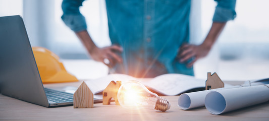 Engineers or architects is watching on light bulb for concept of construction Design Ideas...