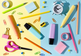 Children's accessories for study, creativity and office supplies on a colored paper background....
