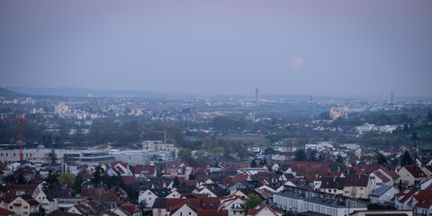 Homes with moon in the sky