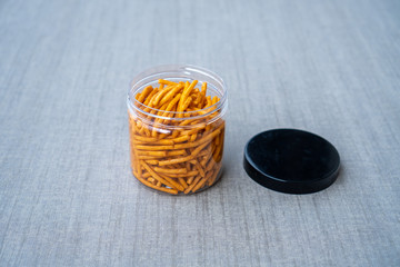Thai Snack and Dessert, Salted Crispy Breadsticks, Grissini or Dipping Sticks in plastic bottle Isolated Background.